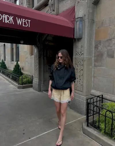 a woman wears satin shorts