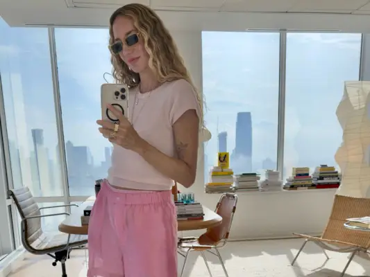 a woman wears pink shorts