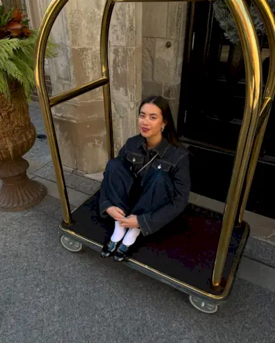 Influencer wears black ballet flats with white socks.