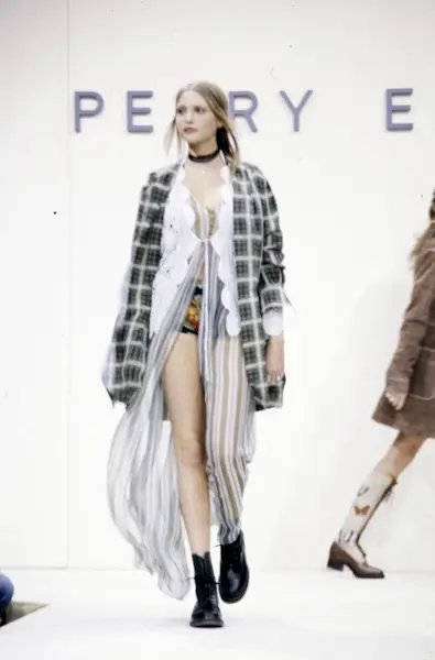 An image of plaid shirts on Perry Ellis' SS93 runway.