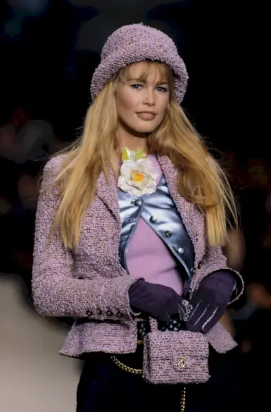 Claudia Schiffer wears a purple tweed rolled-brim hat from Chanel in 1994.