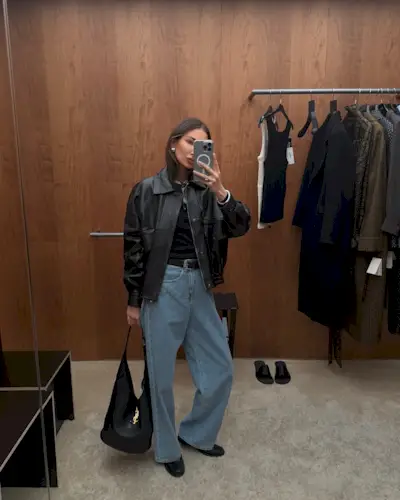 Influencer wearing a leather bomber jacket