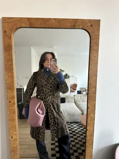 Fashion editor wearing big Coach bag