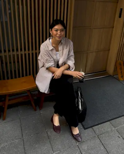 Influencer wears burgundy ballet flats