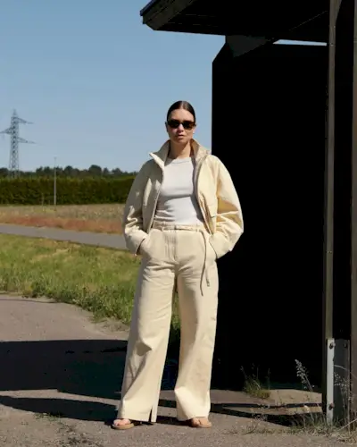 Woman wearing khaki denim trend 2025.