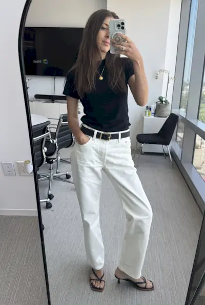 Woman in white Levi's and black t-shirt