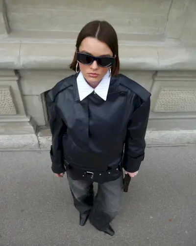 woman wearing black leather jacket and light black jeans