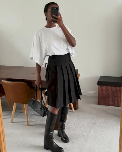 Influencer wearing riding boots.