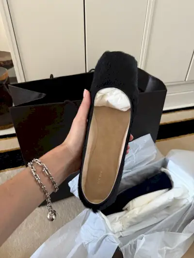 The Row calf-hair flat shoes.