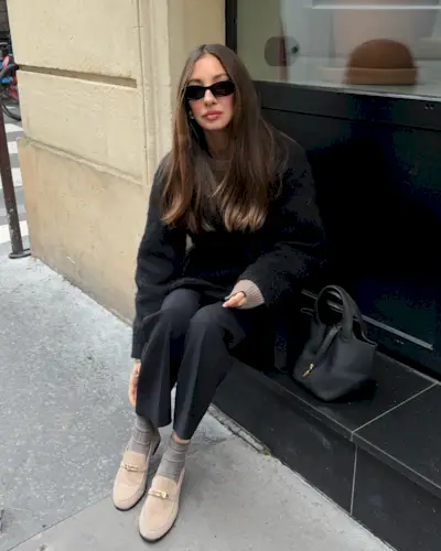 Influencer wearing suede loafers.