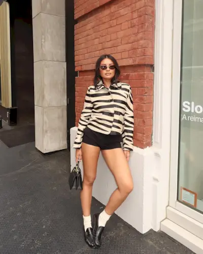 woman wearing fall loafer outfit idea 2025