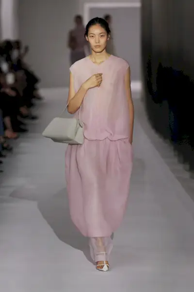 Model on the Khaite spring/summer 2024 runway wearing powder pink.