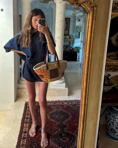 woman wearing matching linen set and gladiator sandals