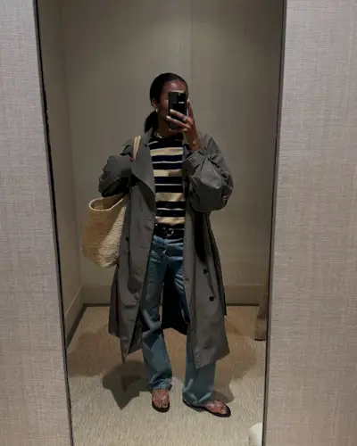 woman wearing jeans and jelly flip flops