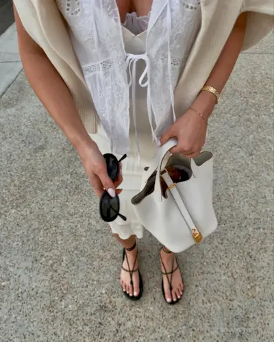 woman wearing all-white outfit with black sandals