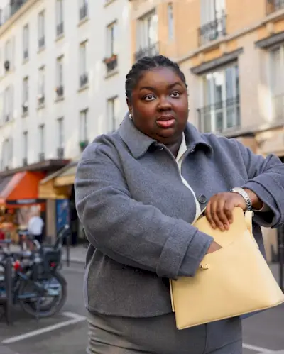 An image of @abimarvel wearing a knit jacket, one of the top jacket trends of 2025.