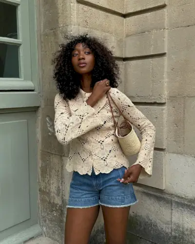 @emmanuellek_ wears a crochet top, blue shorts and a basket bag