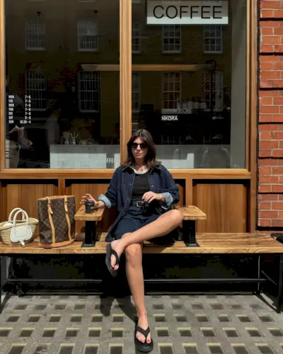 @francescasaffari wears denim Bermuda shorts, a tank top, denim jacket and black flip-flops