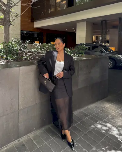 Div Ravindran wears a sheer skirt outfit.