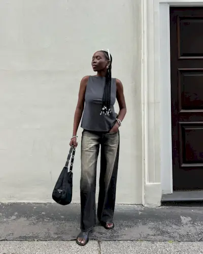 Woman wearing a boatneck top.
