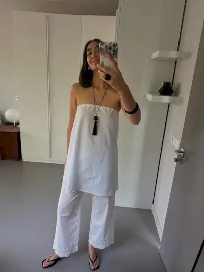 Selena Mual wearing scallop-trim pants.