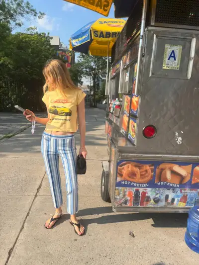 Courtney Grow wearing High Sport striped pants.