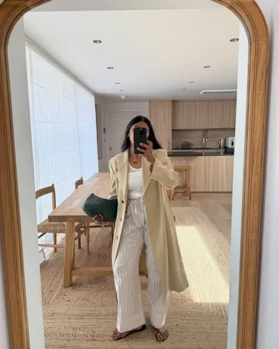 Monikh Dale wearing striped pants.