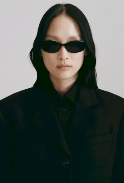 @oliviamarcus wearing black dress and mesh flats