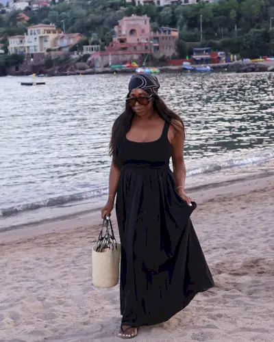 @_loissterling wearing a black dress and basket bag