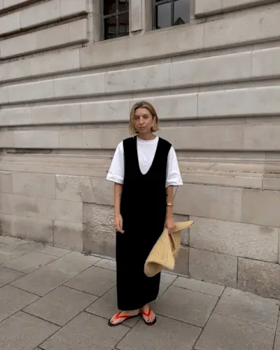 @brittanybathgate wearing black dress and sandals