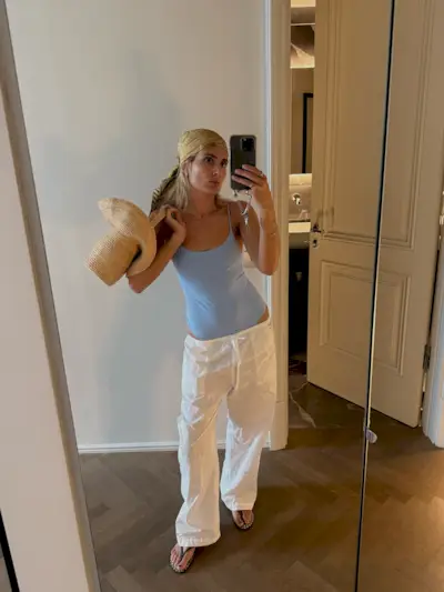 An image of @lucywilliams02 wearing the Haviana x Gimaguas studded sandals, one of the 'it' sandals of 2025.