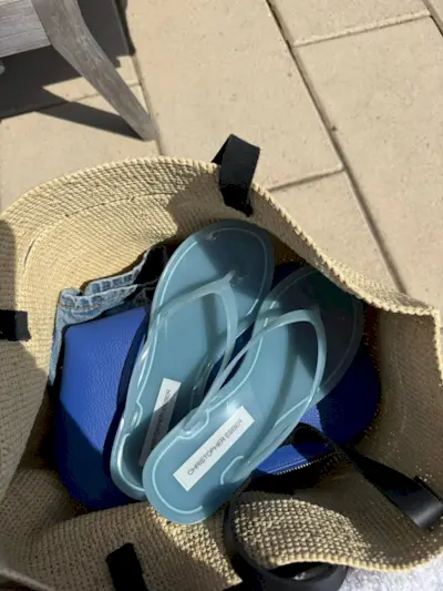 An image of @caitlinburnhamm wearing the Christopher Esber Jo flip flop, one of the 'it' sandals of 2025.