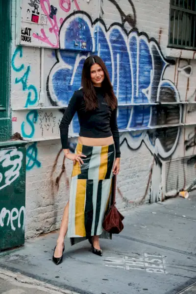 Woman wearing a column skirt during NYFW S/S 26.