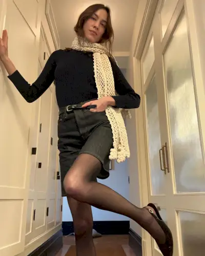 Alexa Chung styles shorts with tights.