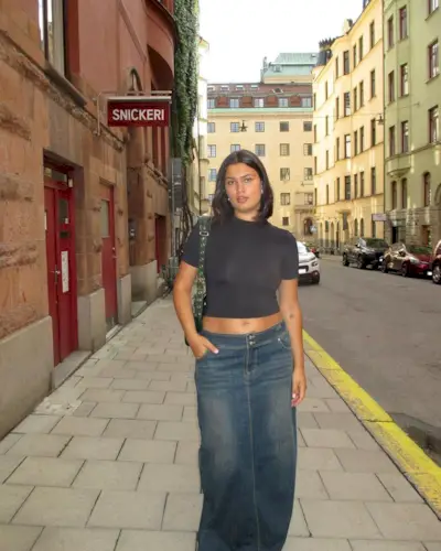 @isabellecoheen wearing a denim midi skirt and cropped t-shirt