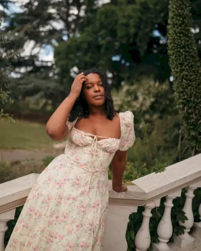 Woman wearing a floral print dress.